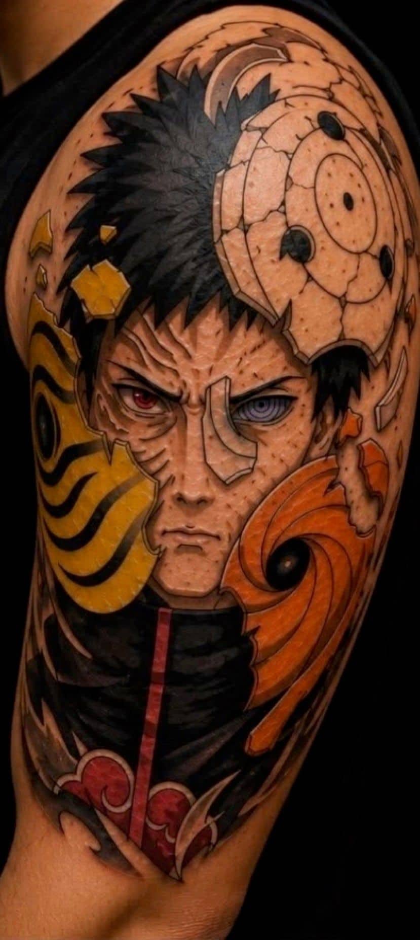 Tattoo by Jake Brewer, Obito Uchiha from Naruto in colour, wrapping an upper arm