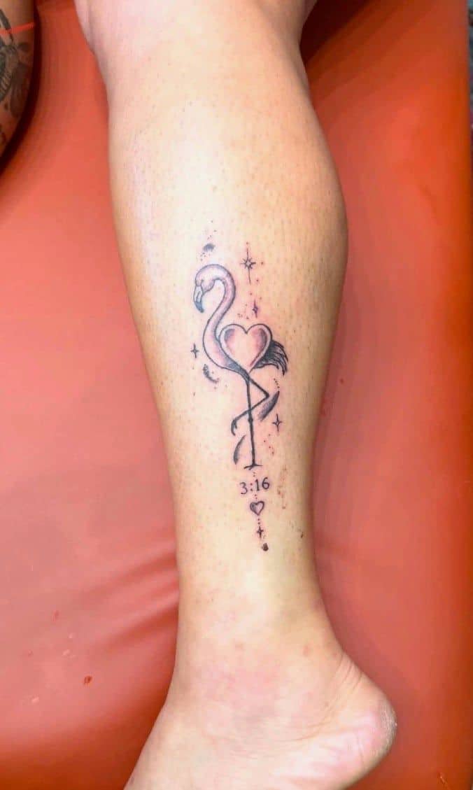 Tattoo by Jake Brewer, fine line flamingo with a small heart on a lower leg